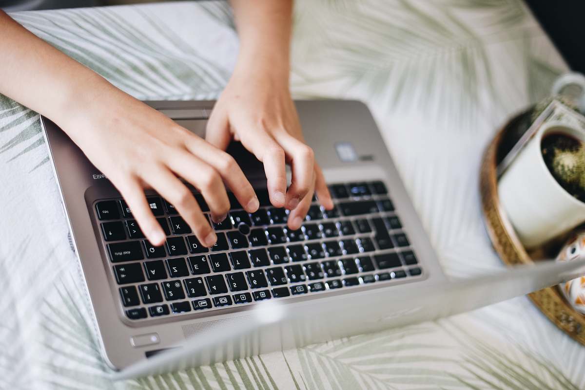computer keyboard person's hand on keyboards laptop electronics